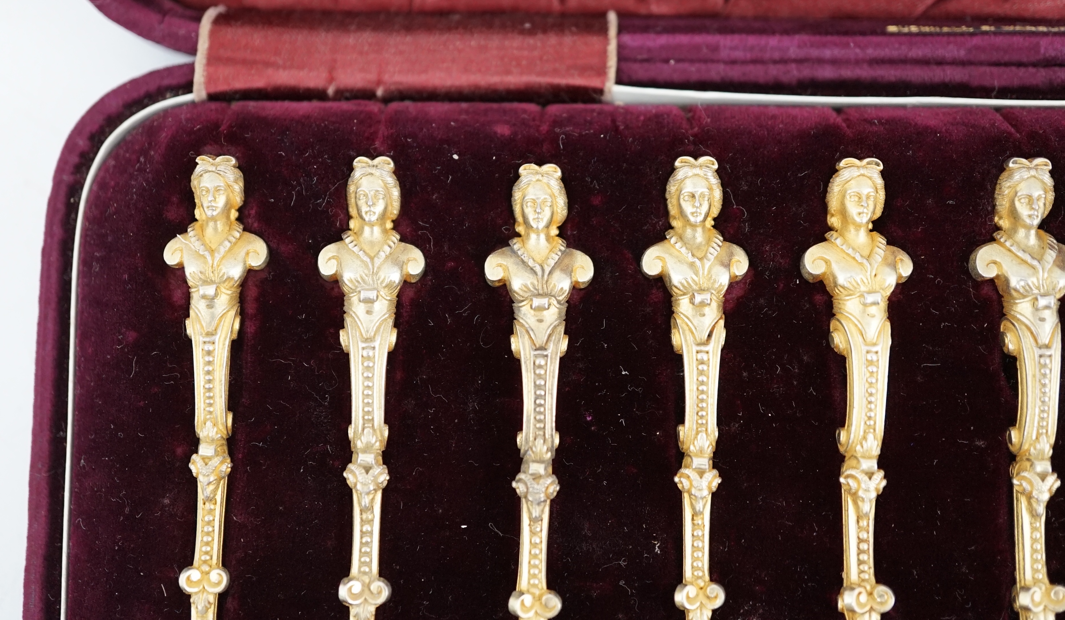 A cased set of twelve late 19th century Russian 84 zolotnik silver gilt caviar spoons by F.E. Henriksen, St. Petersburg